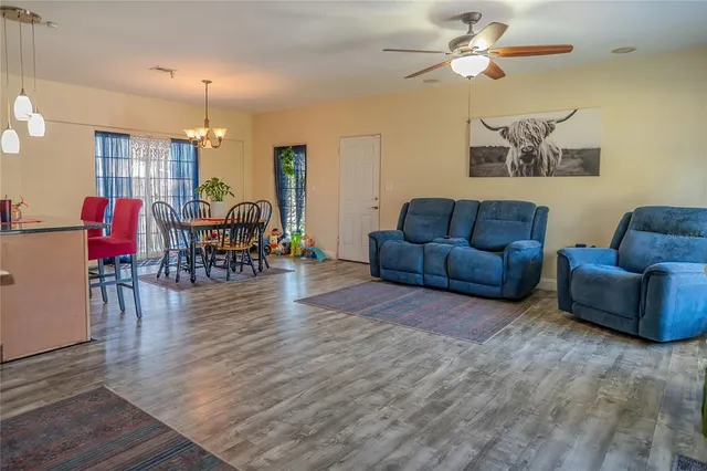 a kitchen with stainless steel appliances granite countertop a refrigerator and a stove