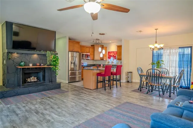 a spacious bedroom with a bed and a chandelier
