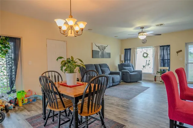 a bathroom with a granite countertop toilet sink and mirror