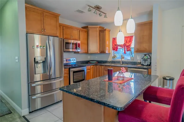 a view of a bedroom with a bed and glass door