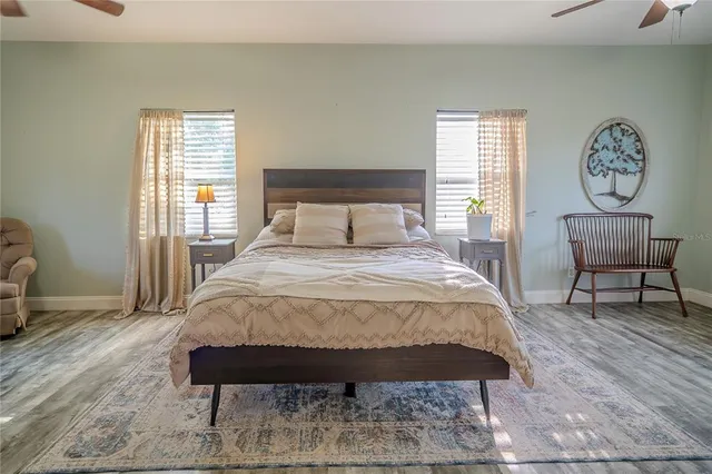 a view of a livingroom with furniture and a flat screen tv