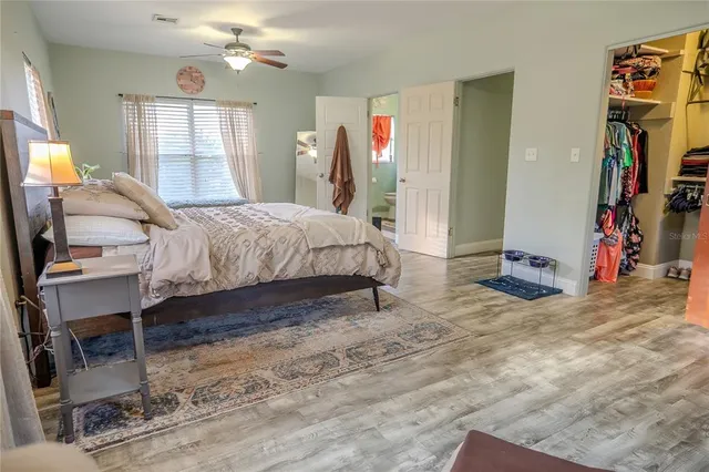a living room with furniture and a mirror