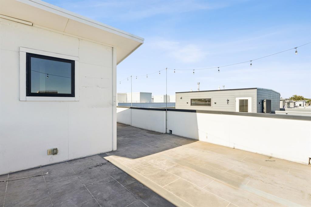 4119 Munger Avenue Dallas, TX 75204 - Photo 25 of 30 a kitchen with cabinets and wooden floor