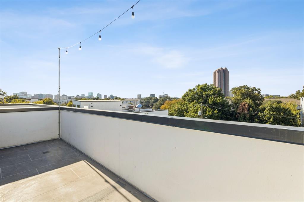 4119 Munger Avenue Dallas, TX 75204 - Photo 26 of 30 a view of a city skyline from a balcony