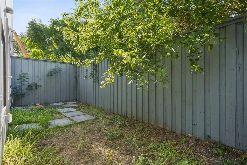 4119 Munger Avenue Dallas, TX 75204 - Photo 28 of 30 a view of small garden with wooden fence