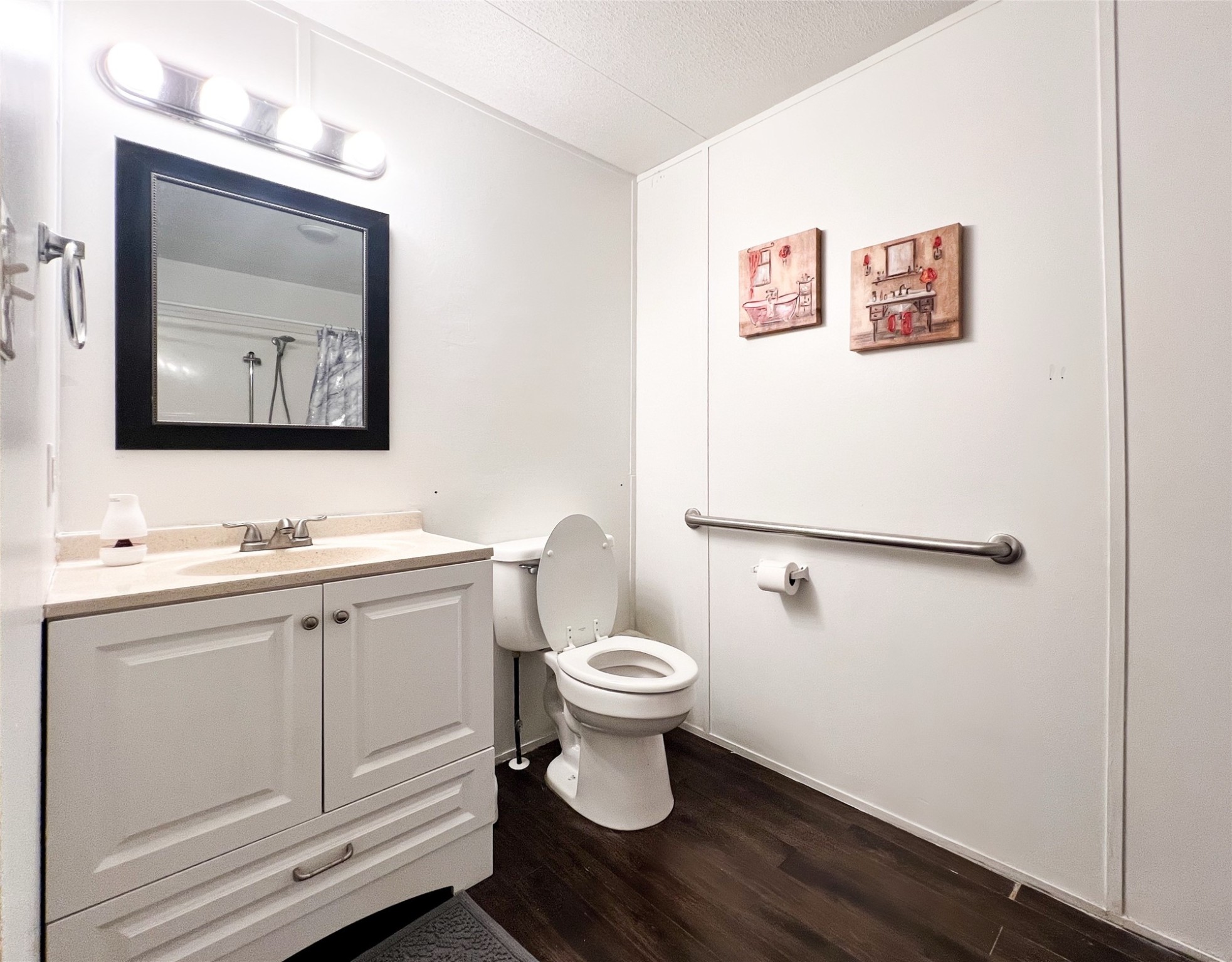 149 Devils Road Goodrich, TX 77335 - Photo 12 of 15 a bathroom with a toilet sink and mirror