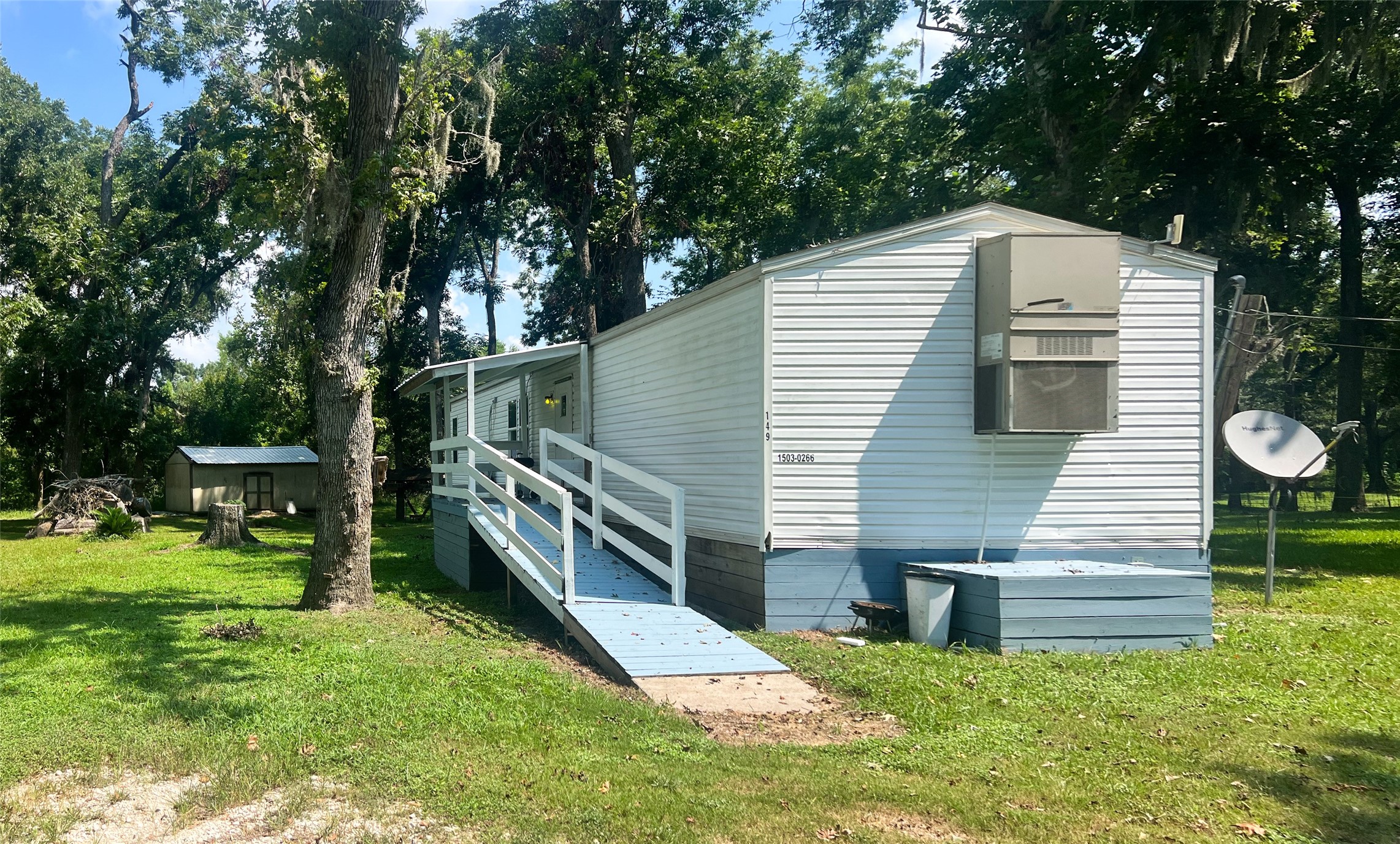 149 Devils Road Goodrich, TX 77335 - Photo 13 of 15 a view of a house with a yard