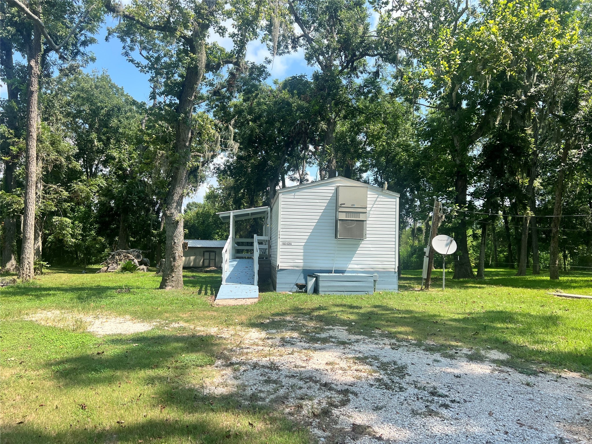 149 Devils Road Goodrich, TX 77335 - Photo 14 of 15 a backyard of a house with trampoline