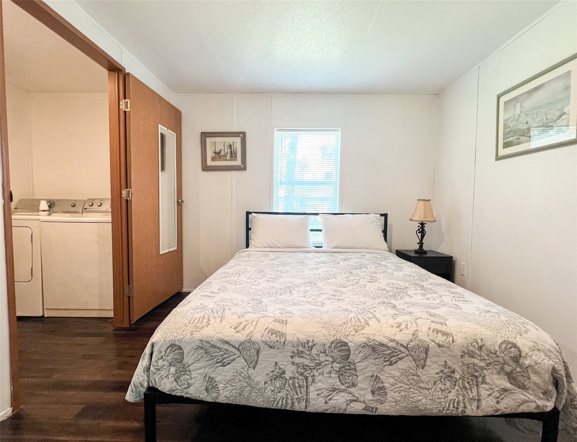 149 Devils Road Goodrich, TX 77335 - Photo 6 of 15 a bedroom with a bed and wooden floor