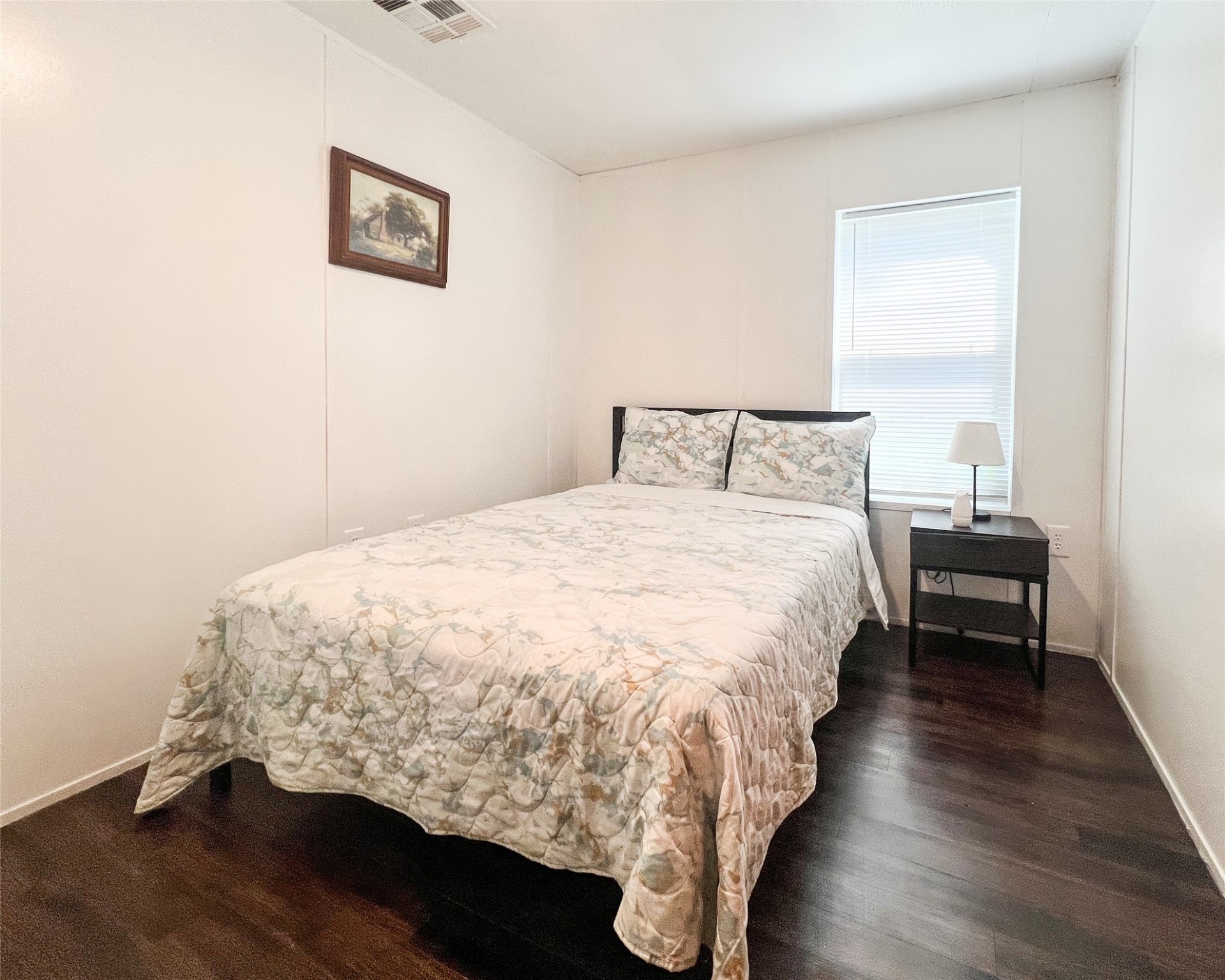 149 Devils Road Goodrich, TX 77335 - Photo 8 of 15 a large bed sitting in a bedroom next to a window