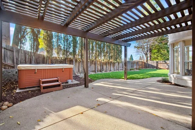 an aerial view of a house with outdoor space