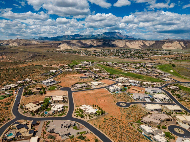Basalt Cir Street, Unit 1027 St. George, UT 84770 - Photo 28 of 29 Aerial view of residential area with a mountainous background