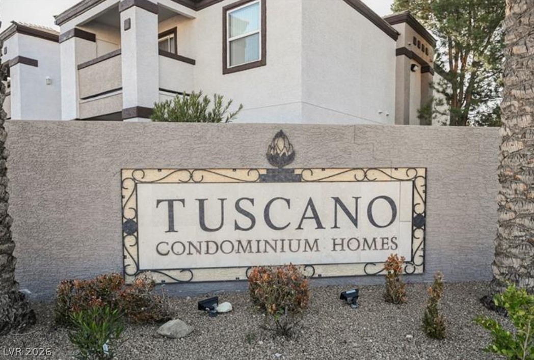 7255 West Sunset Road, Unit 2111 Las Vegas, NV 89113 - Photo 24 of 33 Elegant entrance sign introduces the Tuscan-inspired condominium community.