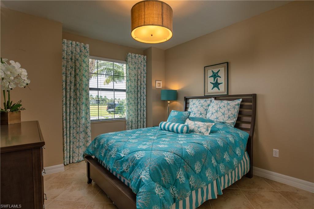 2918 Aviamar Circle Naples, FL 34114 - Photo 14 of 25 a bedroom with a bed and window
