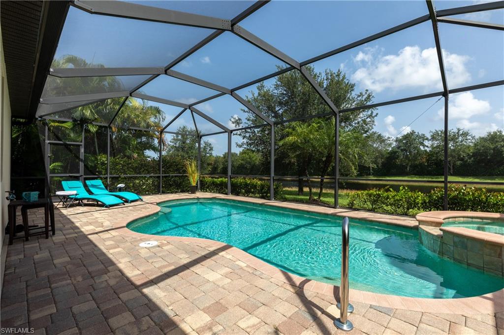 2918 Aviamar Circle Naples, FL 34114 - Photo 2 of 25 a view of a backyard with swimming pool