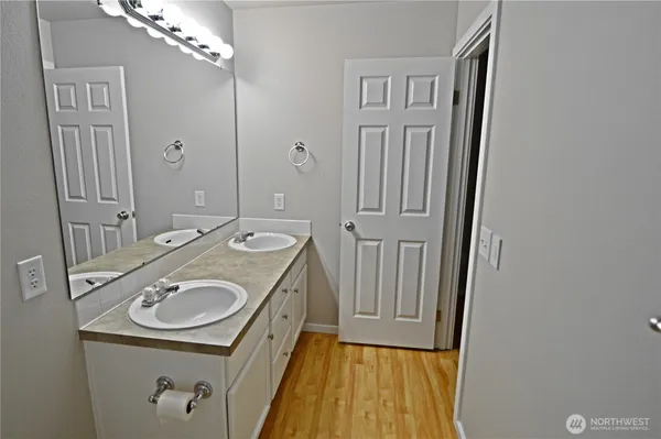 a bathroom with a sink a washer and dryer