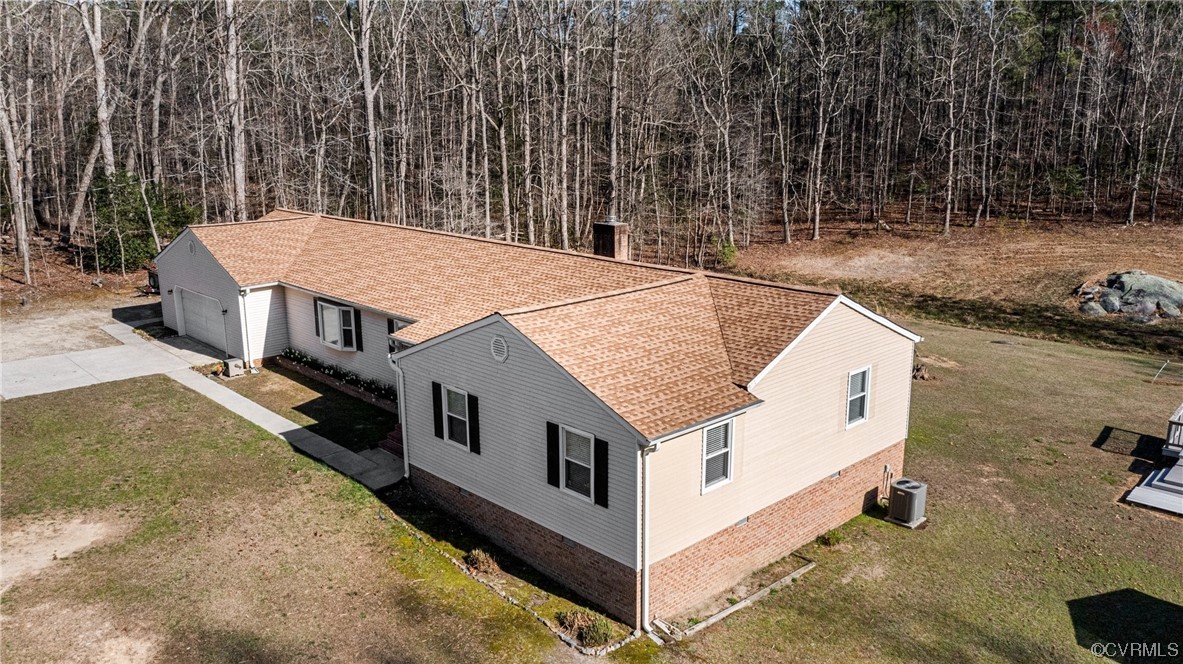 17543 Le Master Road Petersburg, VA 23803 - Photo 1 of 49 an aerial view of a house with swimming pool and large trees