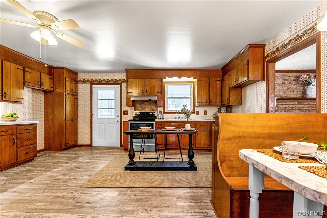 17543 Le Master Road Petersburg, VA 23803 - Photo 16 of 49 a view of a kitchen with dining room and wooden floor