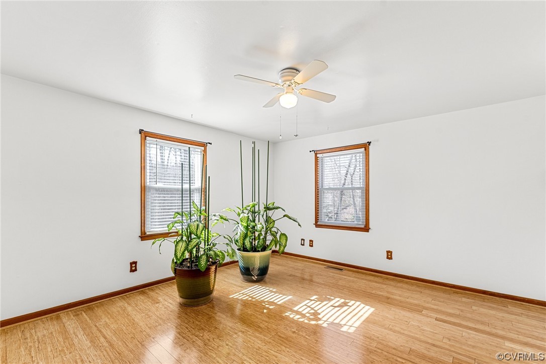 17543 Le Master Road Petersburg, VA 23803 - Photo 22 of 49 a view of an empty room with a window and wooden floor