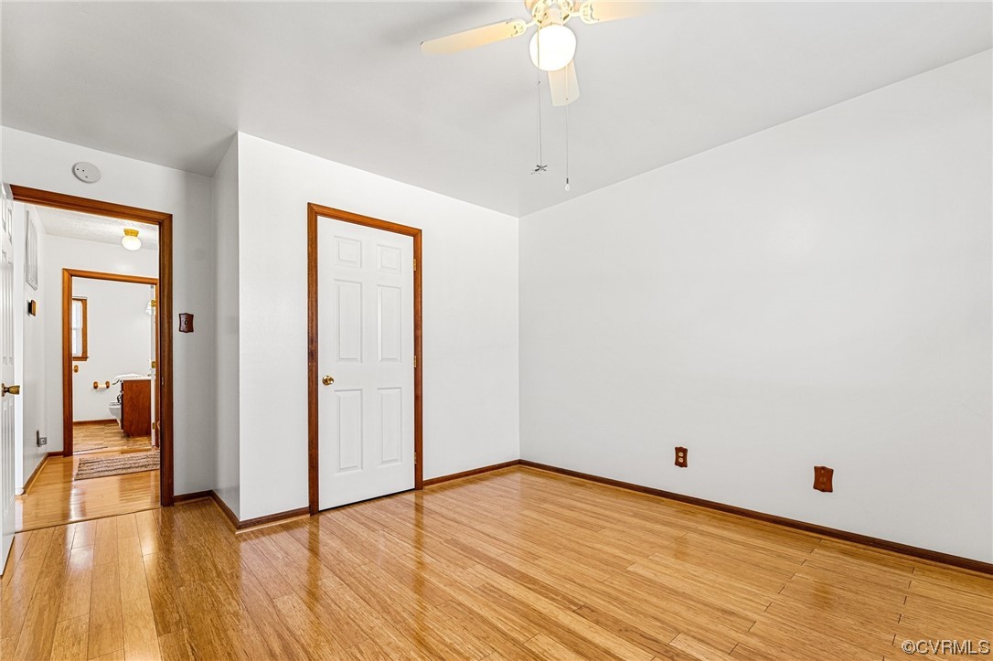 17543 Le Master Road Petersburg, VA 23803 - Photo 26 of 49 a view of a room with wooden floor and a ceiling fan