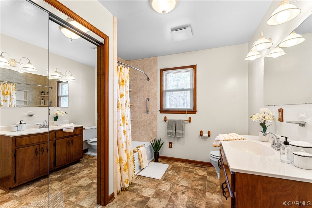 17543 Le Master Road Petersburg, VA 23803 - Photo 28 of 49 a spacious bathroom with a double vanity sink mirror and a bathtub
