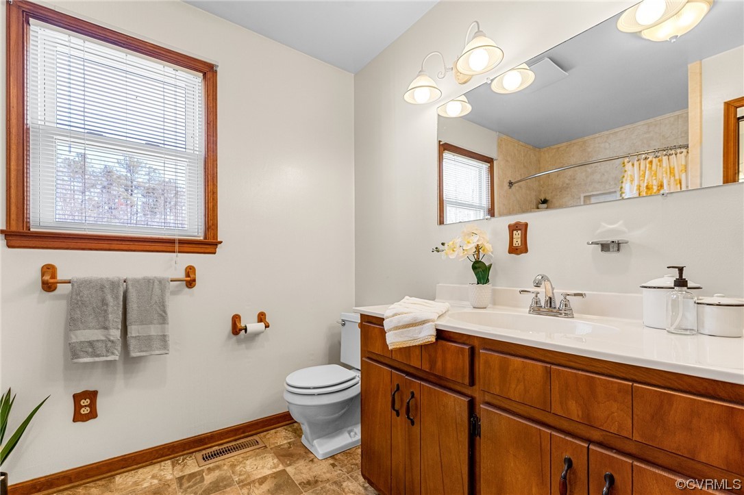17543 Le Master Road Petersburg, VA 23803 - Photo 29 of 49 a bathroom with a sink vanity granite and toilet
