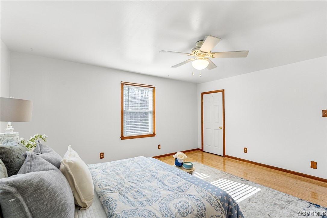 17543 Le Master Road Petersburg, VA 23803 - Photo 31 of 49 a bedroom with a bed and a chandelier