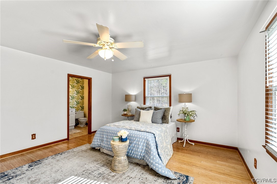 17543 Le Master Road Petersburg, VA 23803 - Photo 32 of 49 a bedroom with a bed and a chandelier