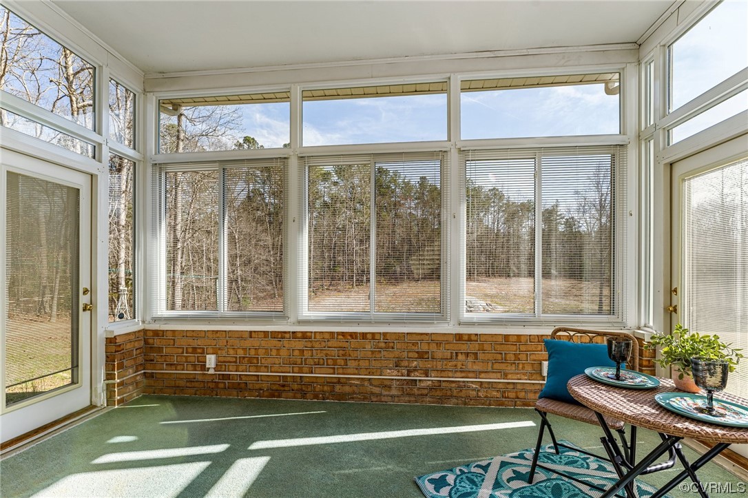 17543 Le Master Road Petersburg, VA 23803 - Photo 36 of 49 a living room with a large window and a table