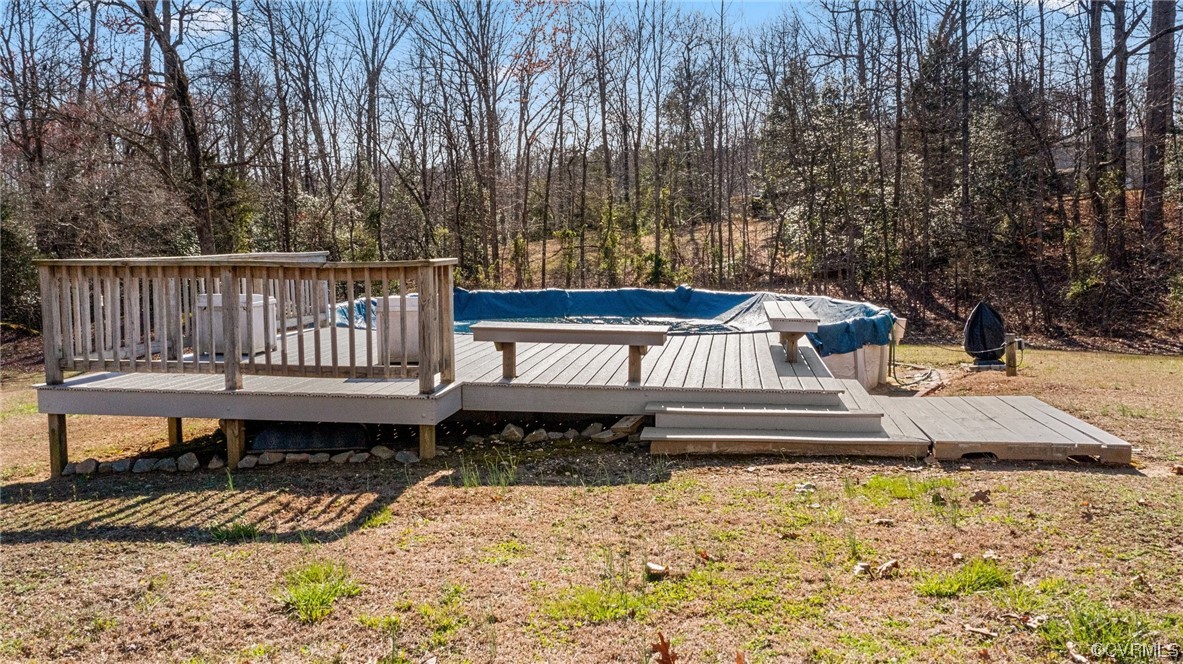 17543 Le Master Road Petersburg, VA 23803 - Photo 41 of 49 a view of a roof deck with a bench