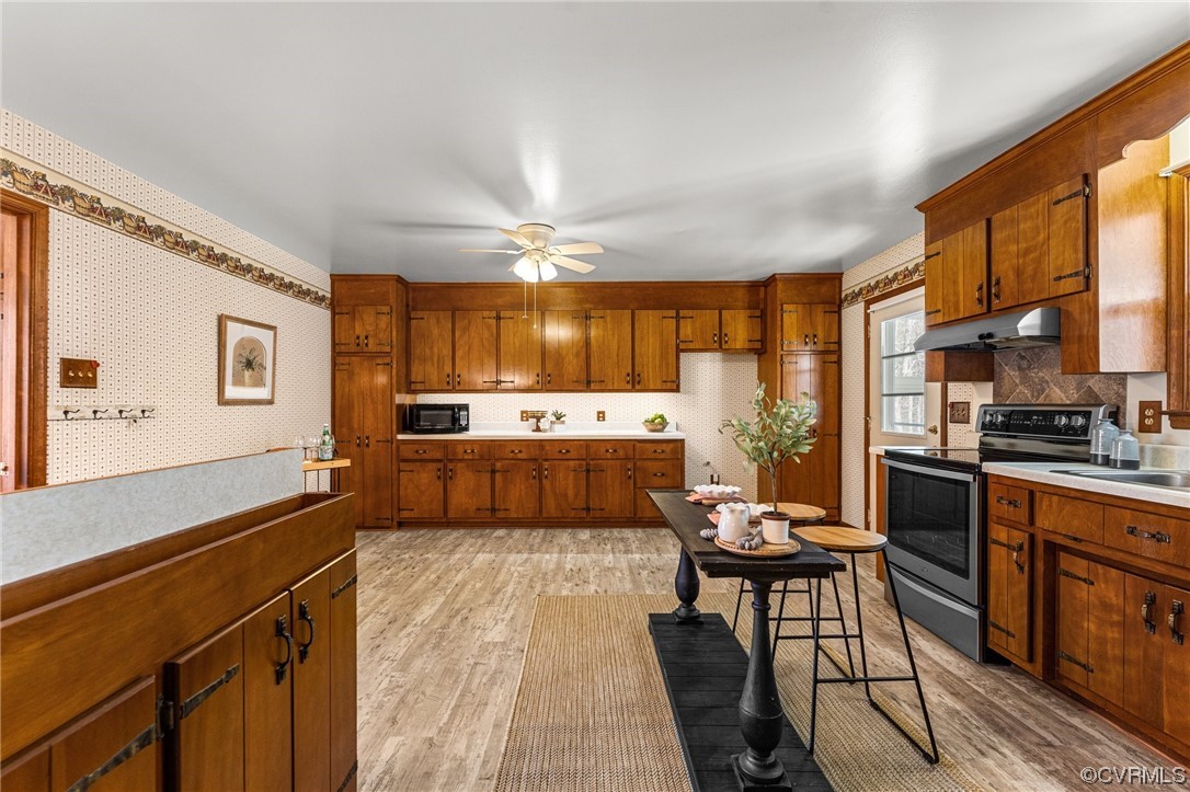 17543 Le Master Road Petersburg, VA 23803 - Photo 10 of 49 a kitchen with a sink stove and cabinets