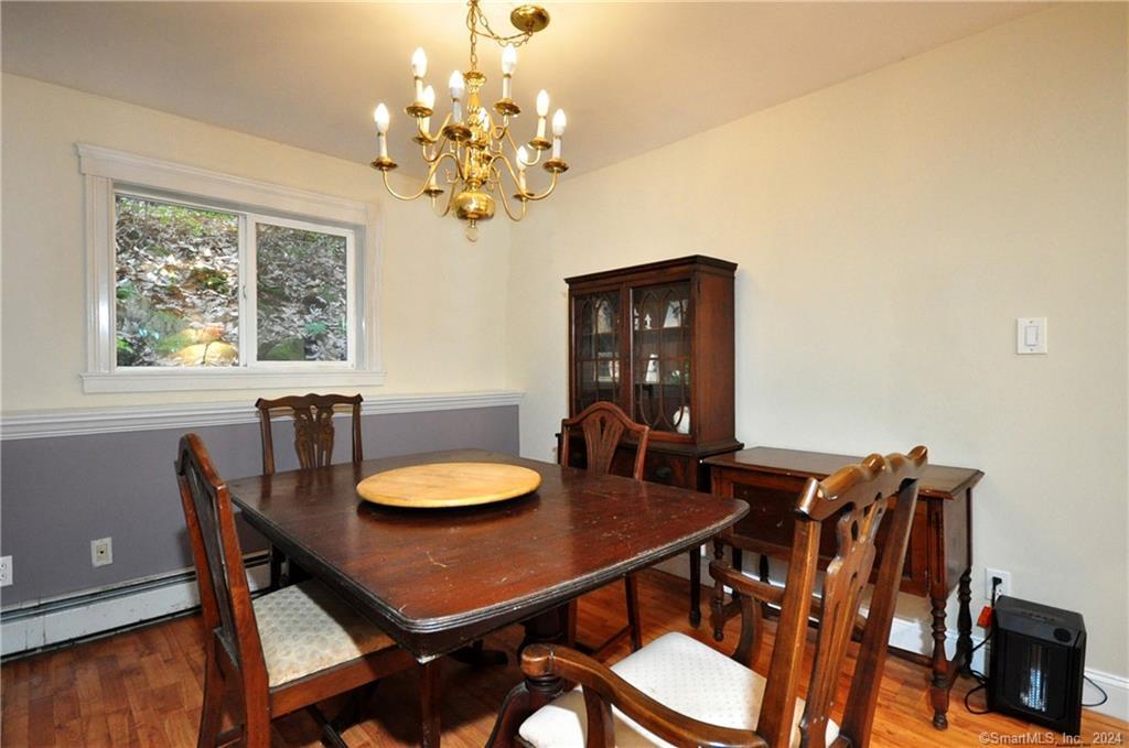 45 Barkhamsted Road Granby, CT 06090 - Photo 32 of 35 a view of a dining room with furniture window and wooden floor