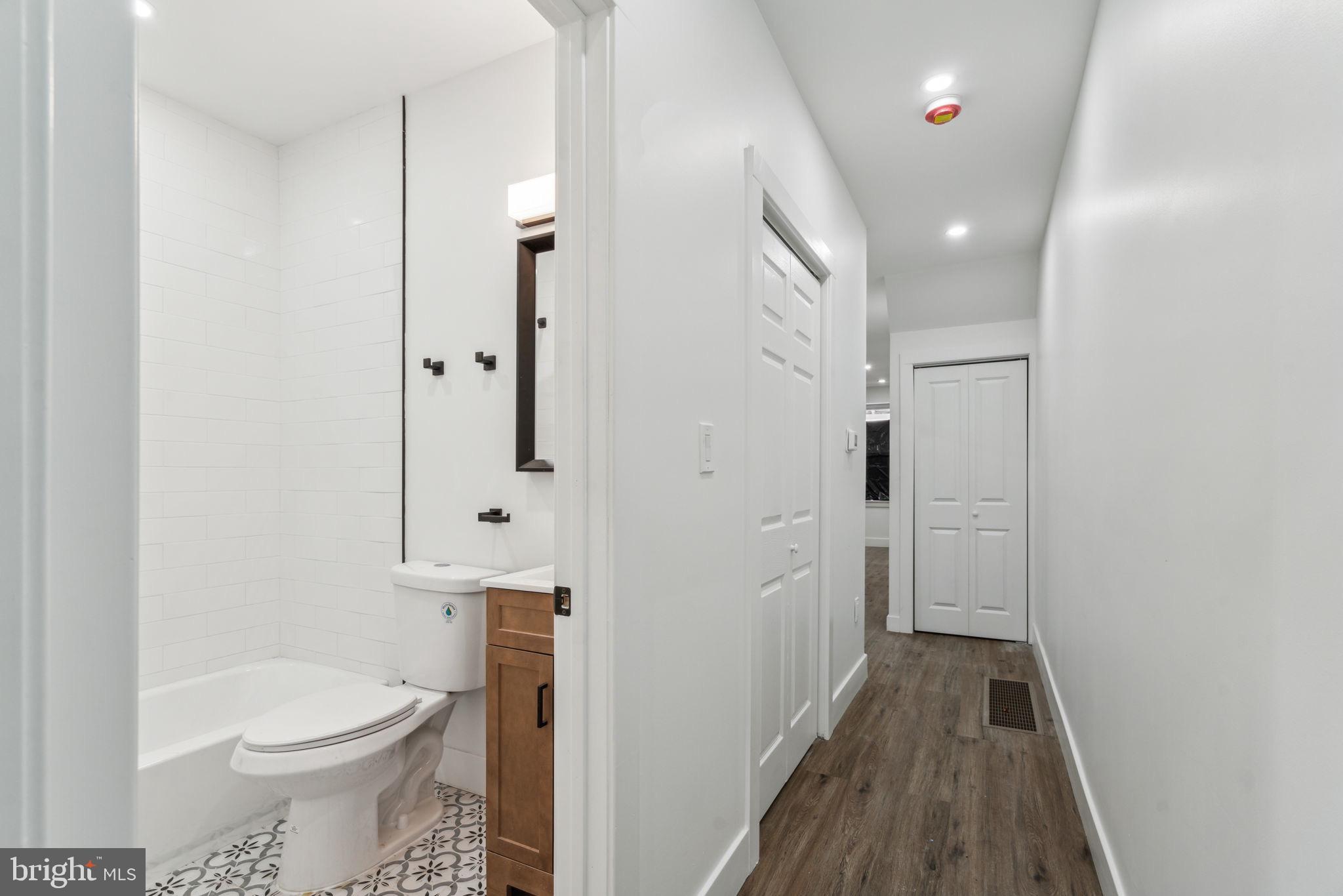 6013 Walnut Street Philadelphia, PA 19139 - Photo 16 of 21 a bathroom with a sink toilet and shower