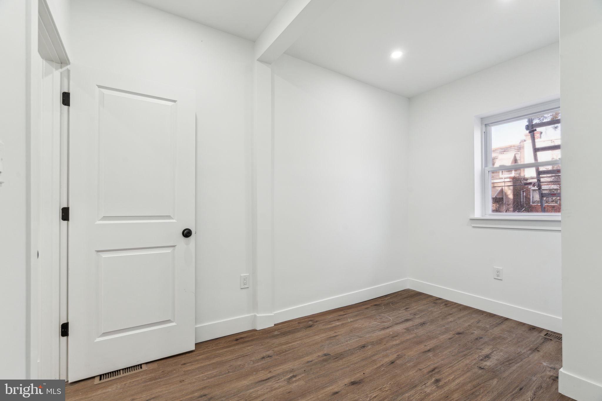 6013 Walnut Street Philadelphia, PA 19139 - Photo 17 of 21 a view of a room with wooden floor and white walls