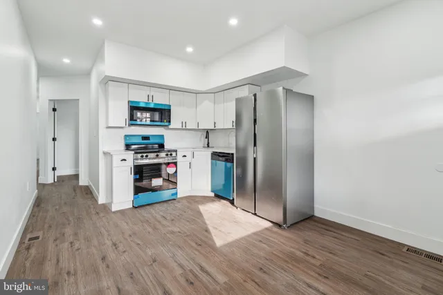 a kitchen with a stove and cabinets