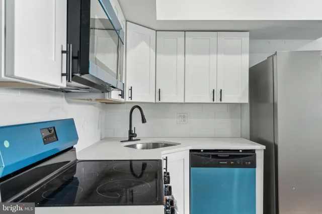 a view of kitchen with wooden floor and stove