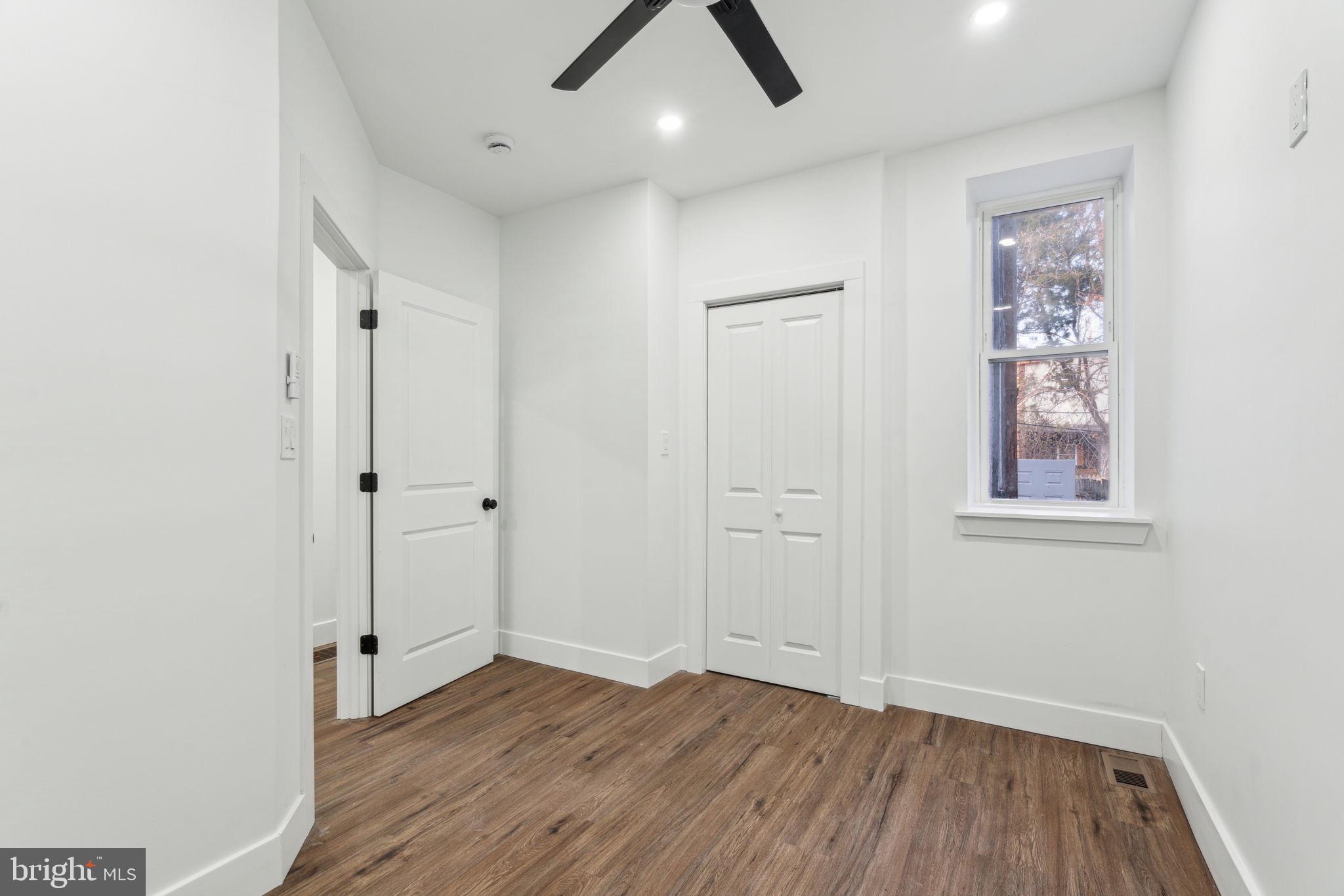 6013 Walnut Street Philadelphia, PA 19139 - Photo 9 of 21 wooden floor in an empty room with a window