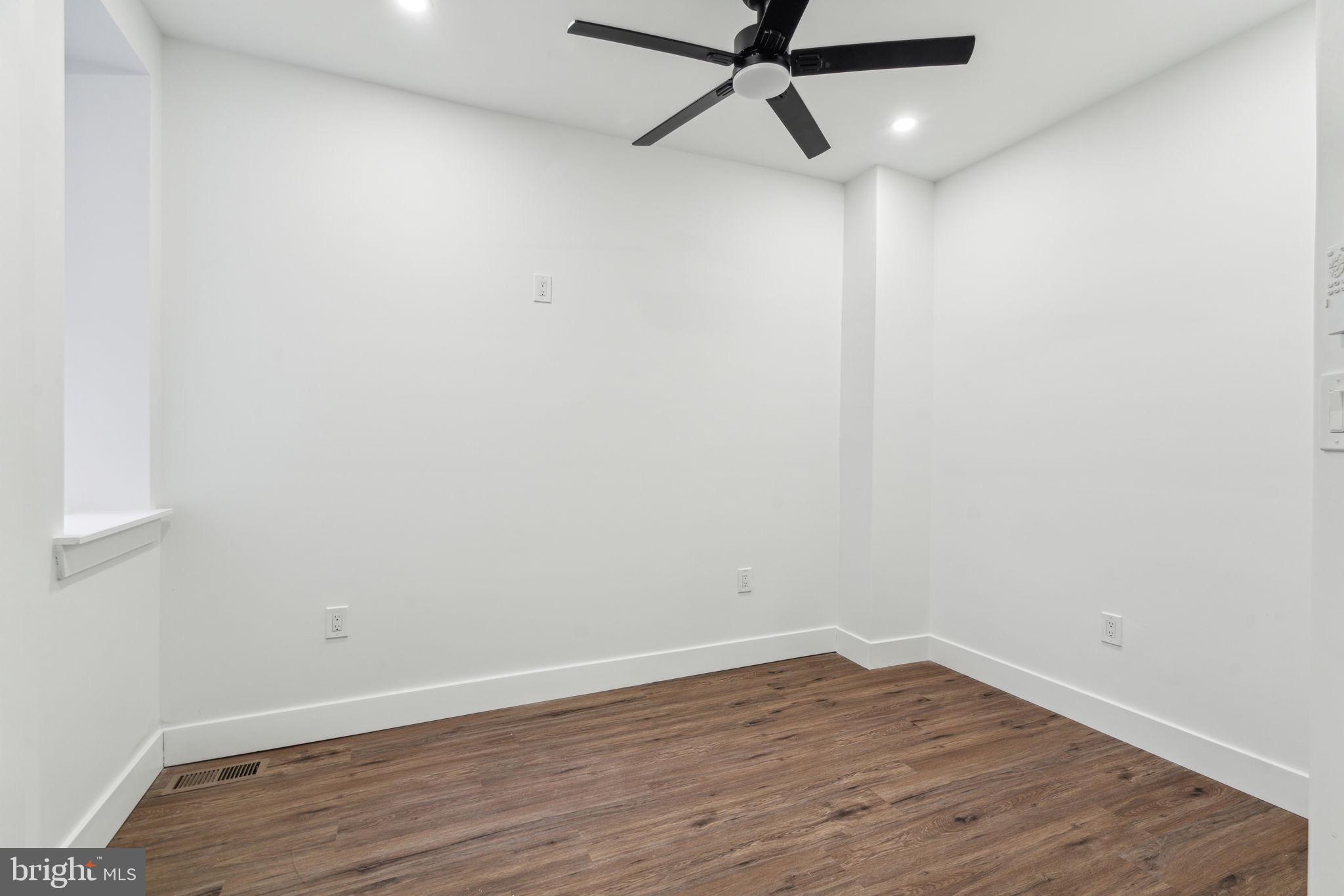 6013 Walnut Street Philadelphia, PA 19139 - Photo 10 of 21 a view of a small space with wooden floor and a window