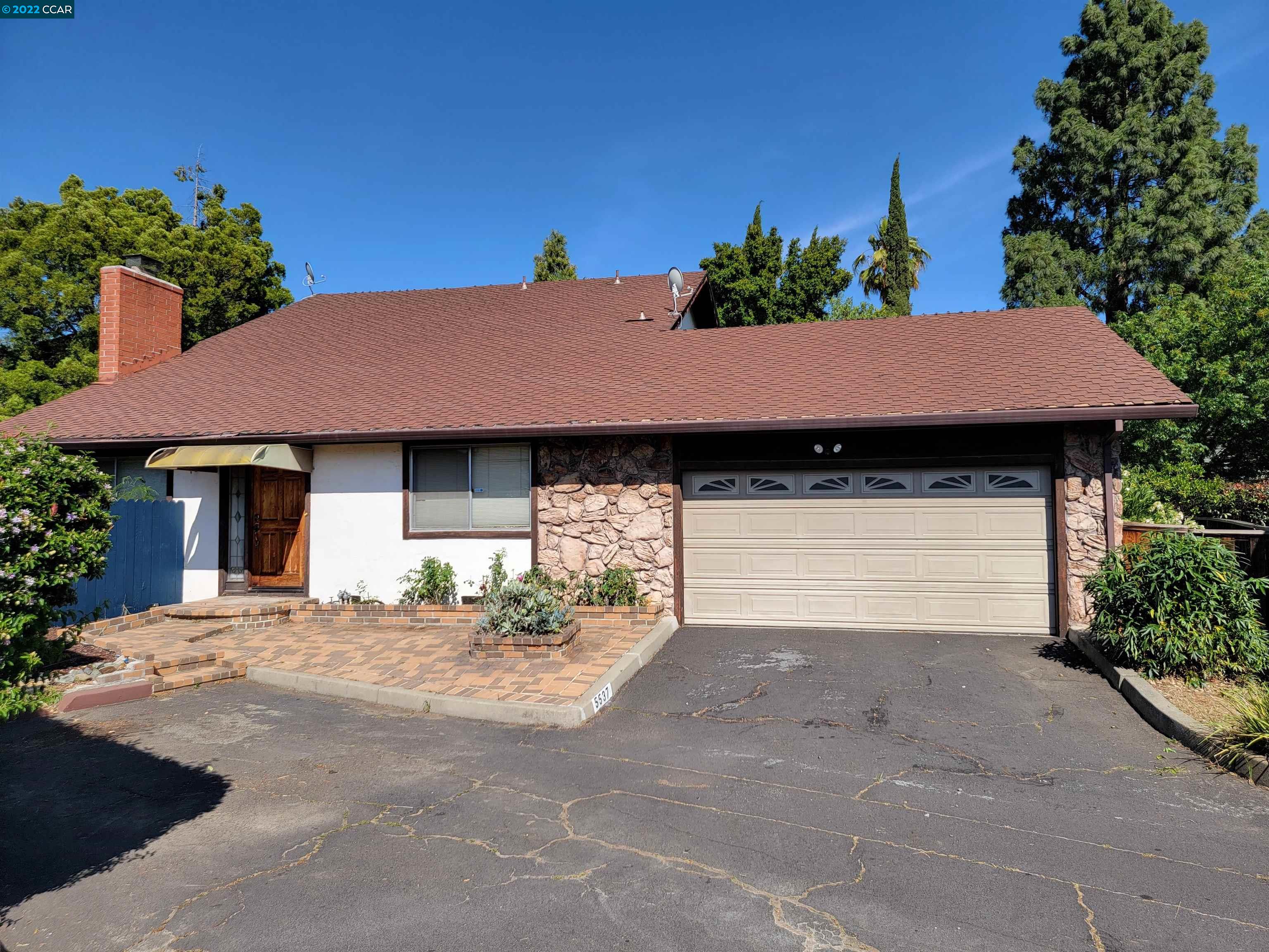 5537 Pamplona Court Concord, CA 94521 - Photo 1 of 1 a view of a house with a yard and garage