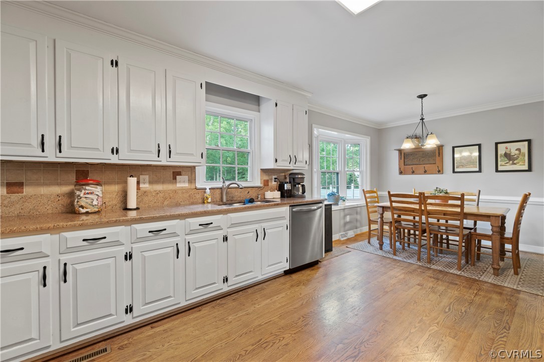 5500 Krag Road Chester, VA 23831 - Photo 18 of 49 a kitchen with stainless steel appliances granite countertop white cabinets granite counter tops and a window