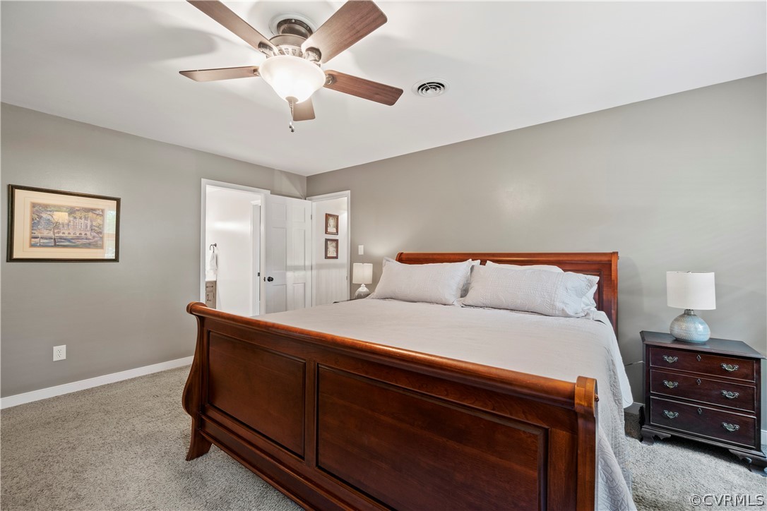 5500 Krag Road Chester, VA 23831 - Photo 29 of 49 a bedroom with bed and a chandelier