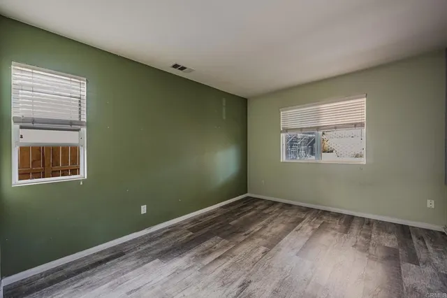 a view of room with window and ceiling fan