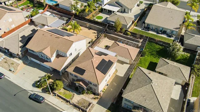 an aerial view of a residential apartment building with a yard