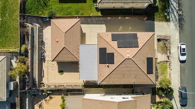an aerial view of a house with swimming pool