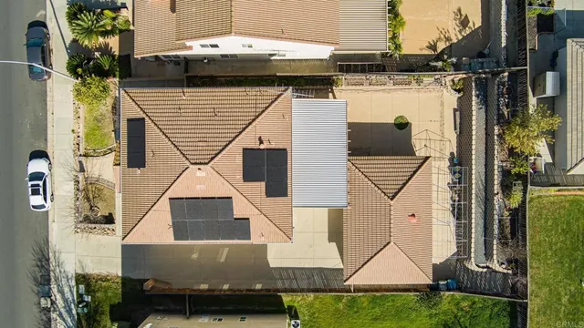 an aerial view of a house with swimming pool