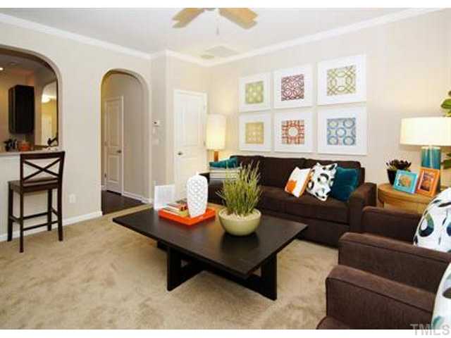 717 Wickham Ridge Road Apex, NC 27539 - Photo 11 of 25 a living room with furniture rug and window