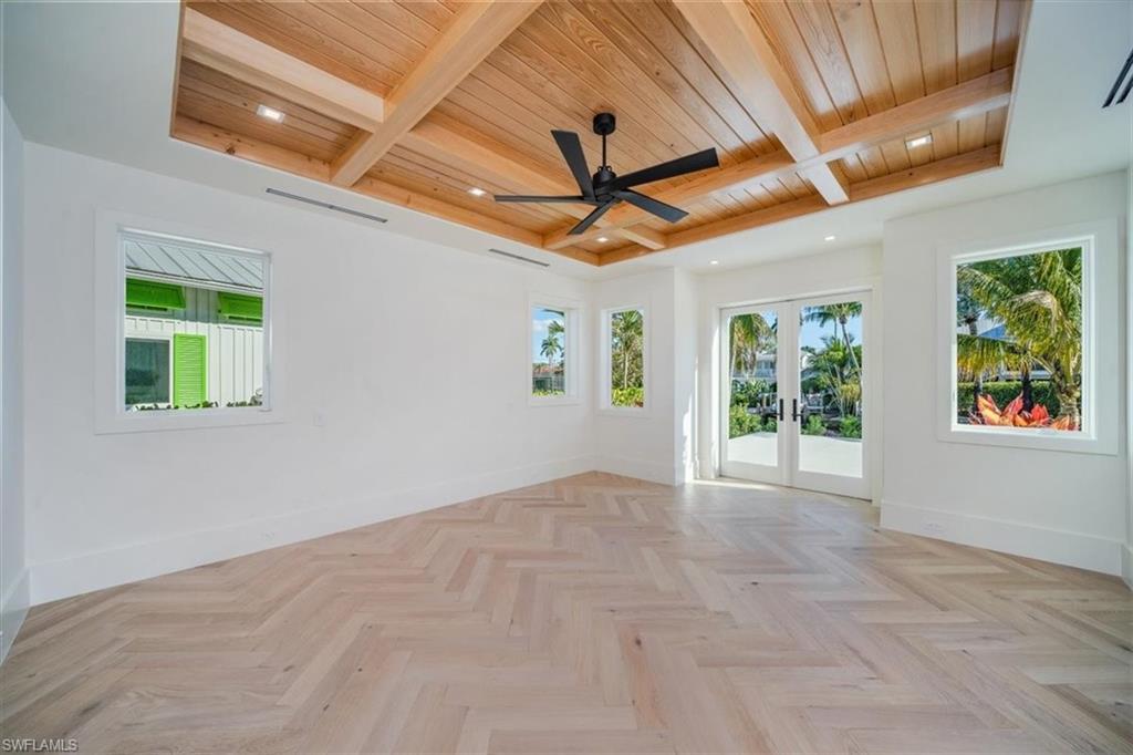 508 16th Avenue South Naples, FL 34102 - Photo 15 of 43 Primary bedroom with french doors to outside patio!
