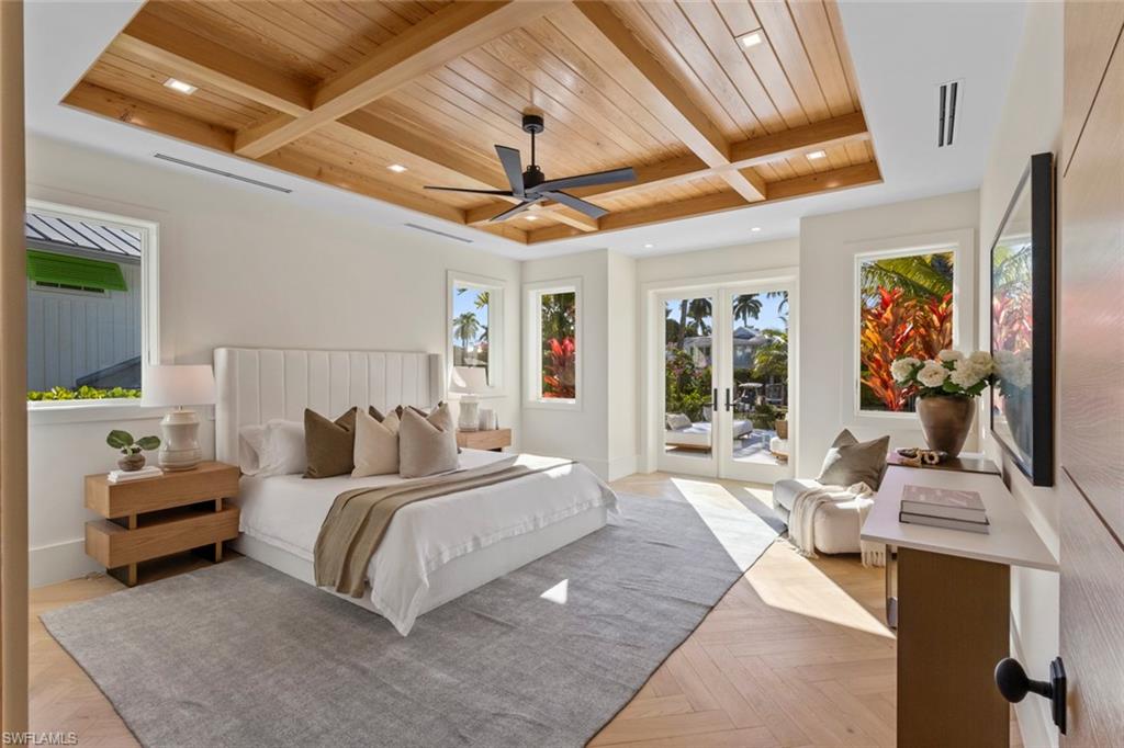 508 16th Avenue South Naples, FL 34102 - Photo 19 of 50 Bedroom with access to outside, a wooden ceiling with exposed beams, ceiling fan, coffered ceiling, and french doors