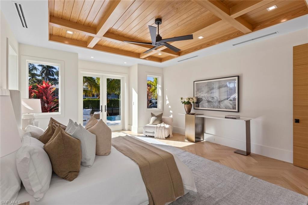 508 16th Avenue South Naples, FL 34102 - Photo 21 of 50 Bedroom with a wooden ceiling with exposed beams, access to outside, coffered ceiling, ceiling fan, and french doors