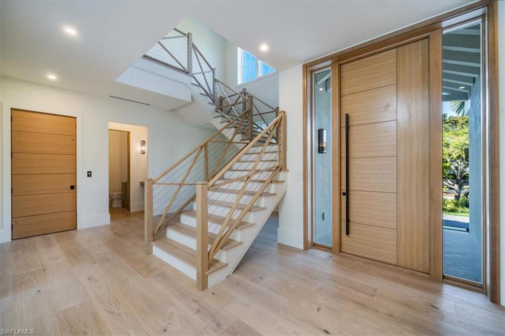 508 16th Avenue South Naples, FL 34102 - Photo 3 of 43 Inside Entryway featuring custom staircase.